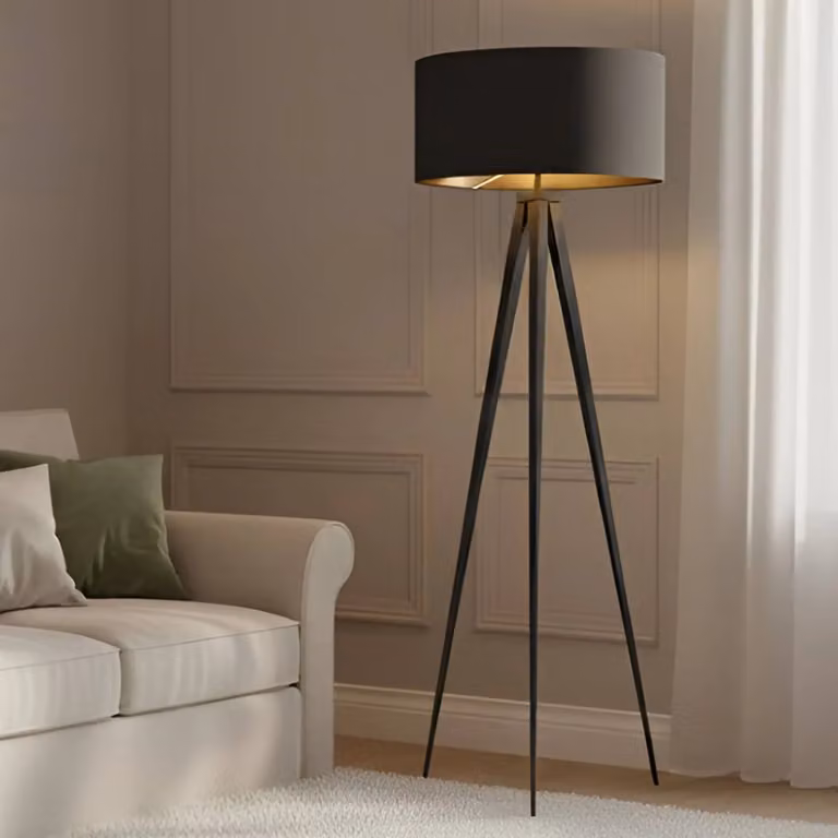 Lámpara de pie Lindby moderna en negro y oro con pantalla textil para salón