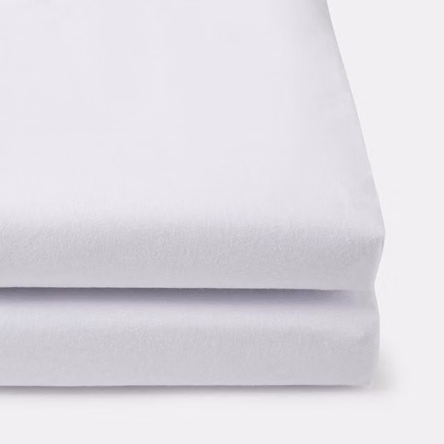 Pack de 2 sábanas bajeras ajustables de algodón jersey Cotton Juice Baby Home para bebés en color blanco
