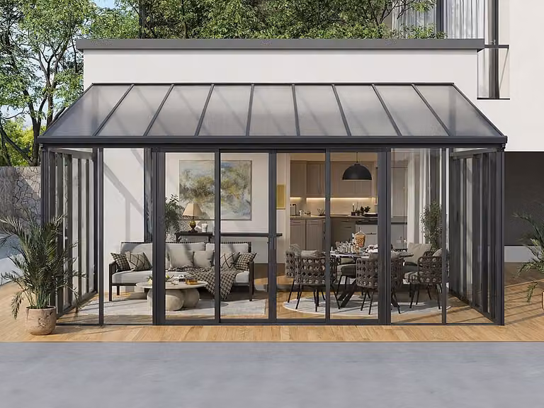 Veranda de aluminio y policarbonato MATHILDA con protección UV, diseño moderno de apoyo a la pared, color antracita y 20,9 m²