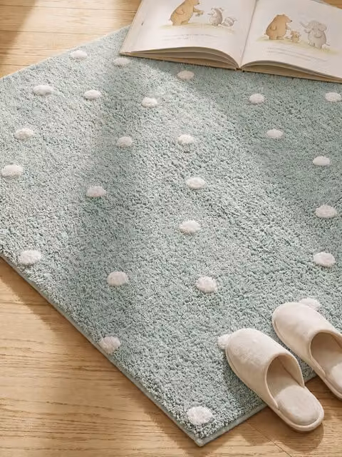 Alfombra infantil Dots de Kenay Home en color verde menta, diseño de puntos y forma redonda, de algodón, An/P: 150 x 100 cm