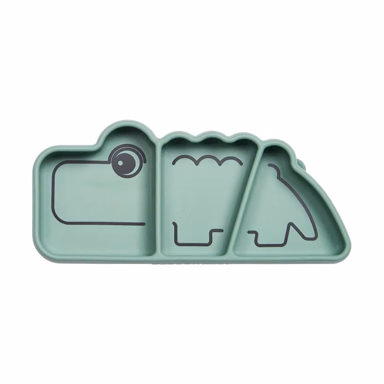 Plato infantil de silicona Done by Deer Croco Stick&Stay color verde de 9 x 21 cm