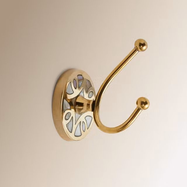 Colgador de pared de metal El Corte Inglés en color beige y dorado con acabado mate y estilo vintage