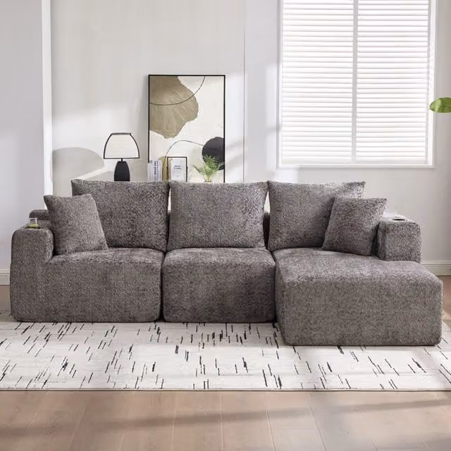 Sofá Esquinero Modular Kellany en Gris con Portavasos, Diseño en Forma de L Reversible y Asiento Profundo, An/P/Al: 261 x 165 x 80,5 cm