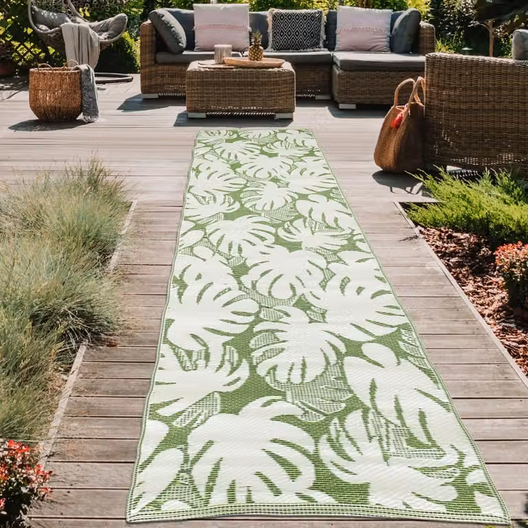 Alfombra de exterior Teppich-Traum con motivos de hojas tropicales en verde y blanco, An/P: 90 x 300 cm