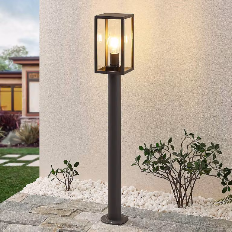 Baliza luminosa de exterior Lindby Filimon en aluminio negro y cristal con tecnología LED atenuable