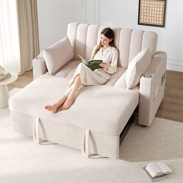 Sofá cama moderno KELLANY en tejido beige con respaldo ajustable, portavasos y cojines incluidos