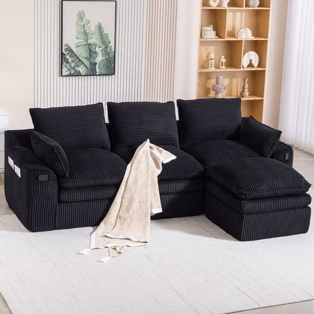 Sofá Modular de 3 Plazas Kellany en Pana Negra con Otomana, Cojines y Diseño Combinable en L para Salón o Despacho, An/P/Al: 263 x 167 x 85 cm