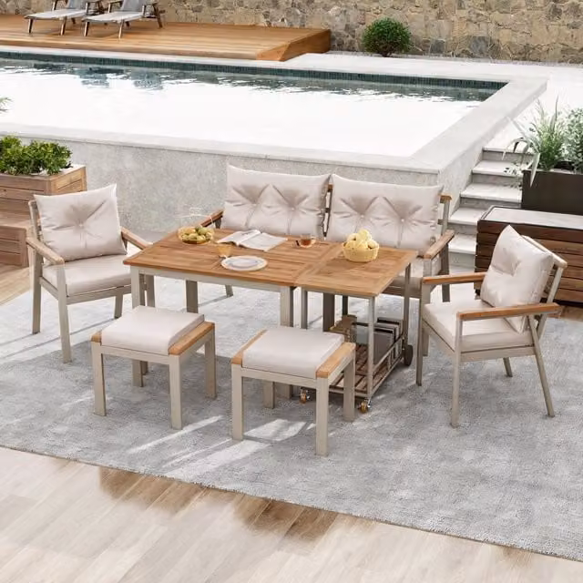 Conjunto de comedor de jardín Stilvora para 7 personas con mesa, sofá, 2 sillones, 2 taburetes, mesa auxiliar y cojines extraíbles en madera de acacia y metal color beige