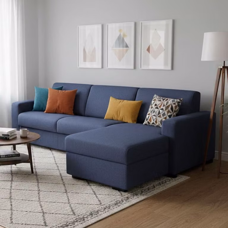 Sofá en forma de L Talamo Italia moderno tapizado en tela azul con cojines incluidos