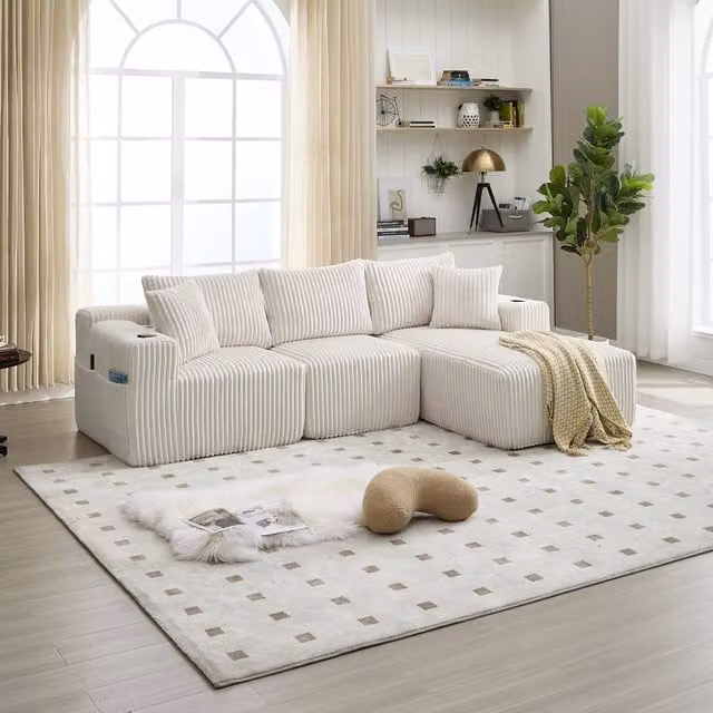 Sofá de 3-4 plazas DREAMMESPACE en pana beige con 5 cojines, portavasos y bolsillos laterales, diseño moderno en forma de L con orientación a la izquierda