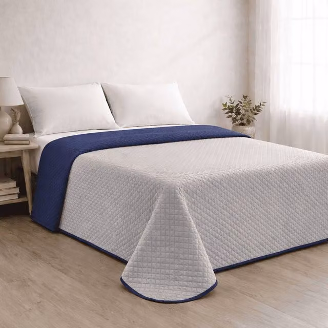 Colcha reversible acolchada Donegal Collections para cama de 90 cm en azul y gris