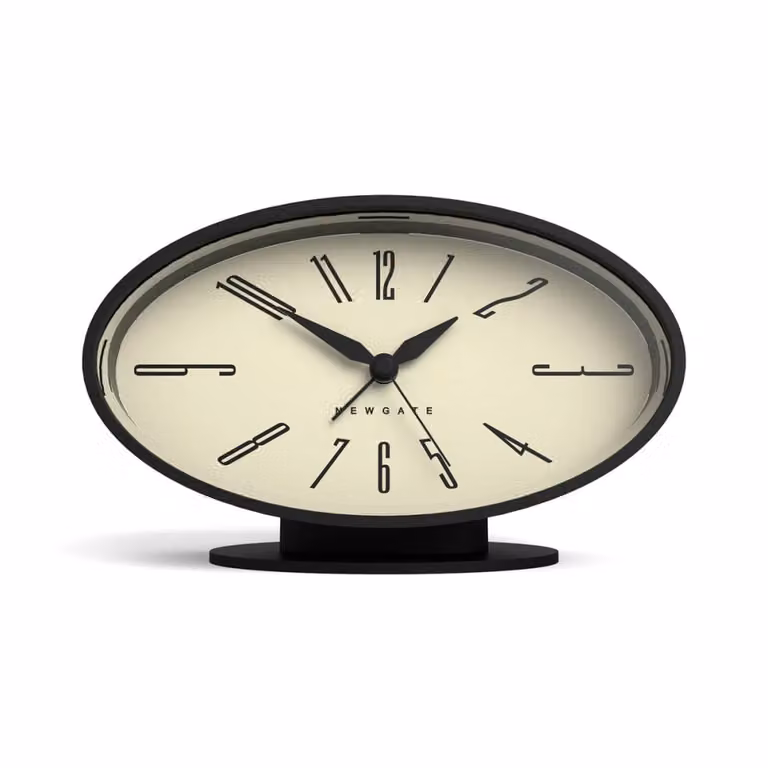 Reloj despertador de mesa Newgate con diseño retro ovalado en metal negro mate y mecanismo de cuarzo silencioso