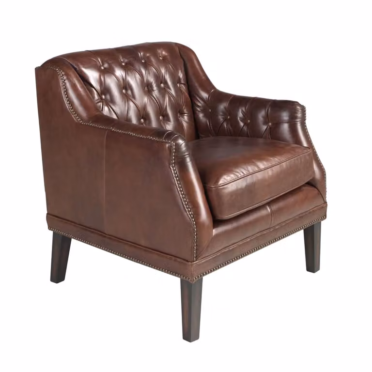 Sillón Chesterfield Angel Cerda en piel marrón coñac con estructura de madera de nogal