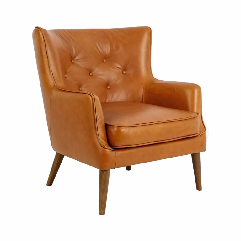 Sillón Chesterfield de Angel Cerdá S.L. tapizado en piel marrón con estructura de madera de nogal