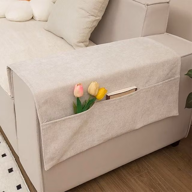 Organizador de reposabrazos para sofá XISRENS con 3 bolsillos grandes, resistente a las manchas, disponible en negro o beige, fabricado en poliéster y lino.