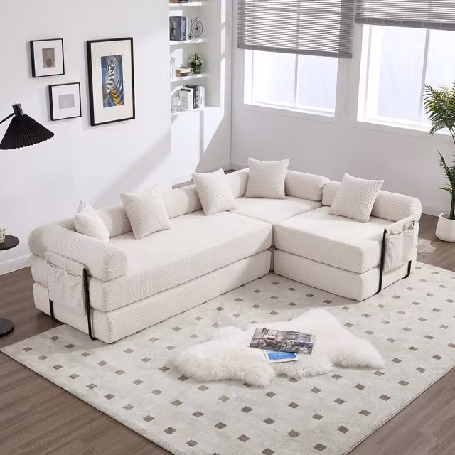 Sofá modular en forma de L Kellany reversible con función de cama y cojines, tapizado en tejido texturizado color beige y blanco, An/P/Al: 270 x 180 x 73.9 cm