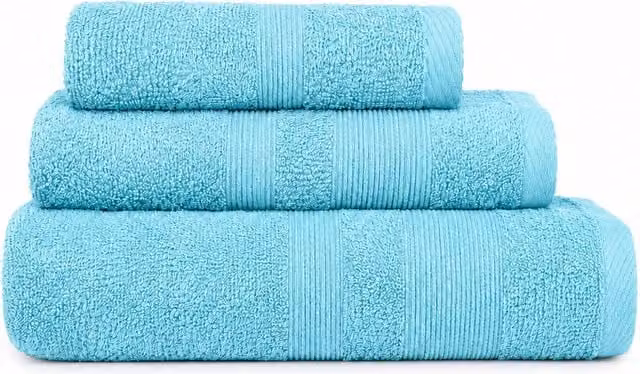 Pack de 3 toallas de algodón suave para lavabo, ducha y baño de Donegal Collections en color turquesa