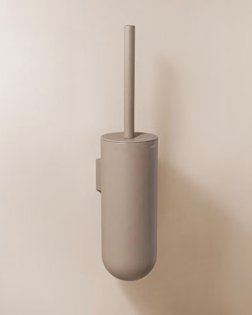 Escobillero de pared Geyser Cosmic con escobilla de diseño ovalado en acero inoxidable color beige