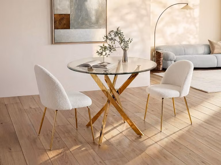 Mesa de comedor redonda Cosima de Vente-Unique con vidrio templado transparente y estructura de metal dorado para 2 personas