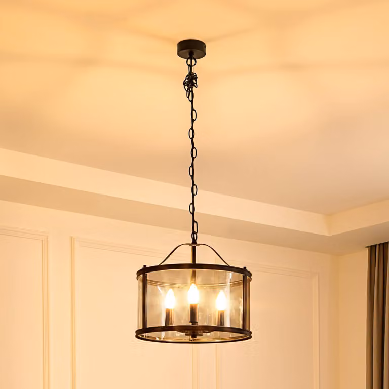 Lámpara colgante Eryk de Lucande con diseño industrial en metal negro y cristal transparente, atenuable, ideal para tu salón o comedor