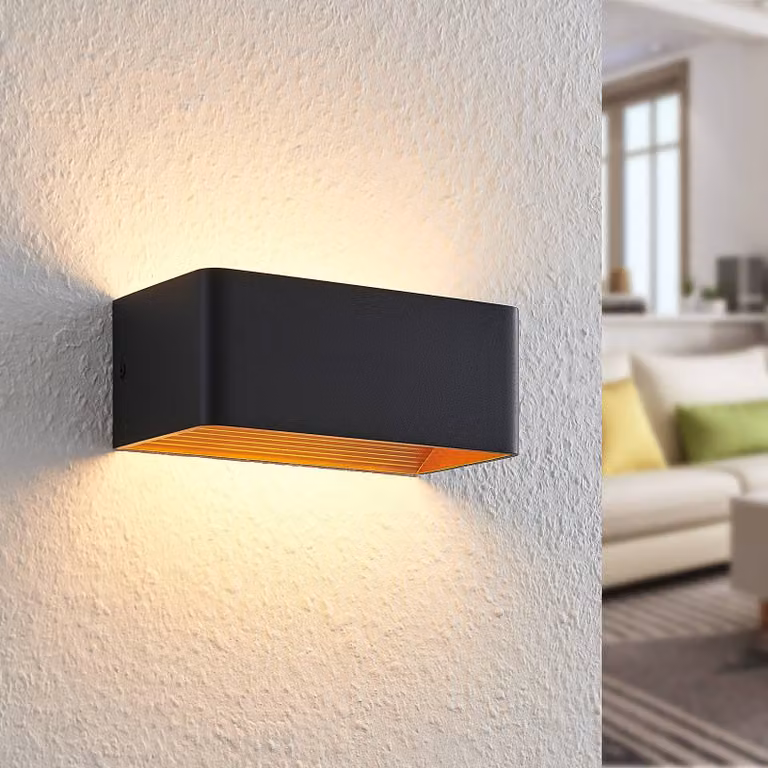 Aplique de pared LED Arcchio en negro y dorado para salón o comedor de estilo moderno fabricado en aluminio