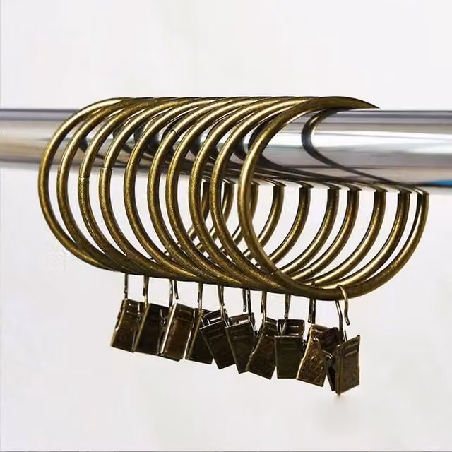 Set de 10 anillas para cortinas Ahlsen de metal color bronce con clips y ganchos decorativos