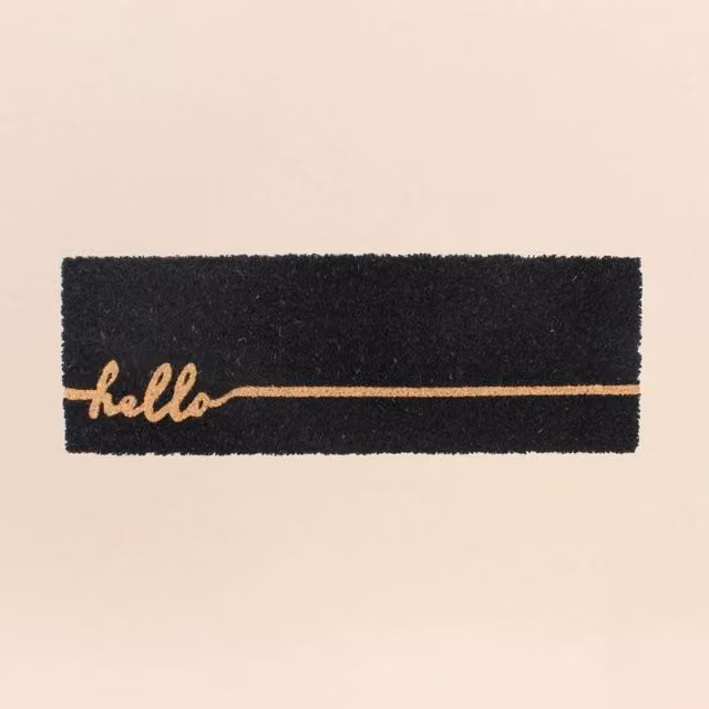 Felpudo rectangular Ornami con diseño Hello en coco y PVC, resistente a la intemperie y antideslizante, colores beige y negro, An/P: 75 x 25 cm