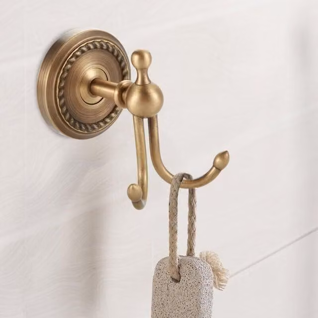 Perchero de pared Elle en metal con acabado mate color oro y bronce para baño, pasillo o dormitorio