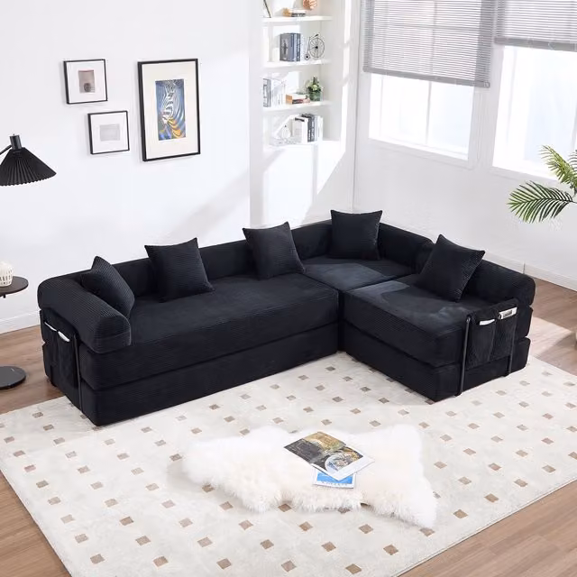 Sofá modular en forma de L Kellany de color negro con tapicería de pana y función de cama para salón o dormitorio, An/P/Al: 270 x 180 x 73,9 cm