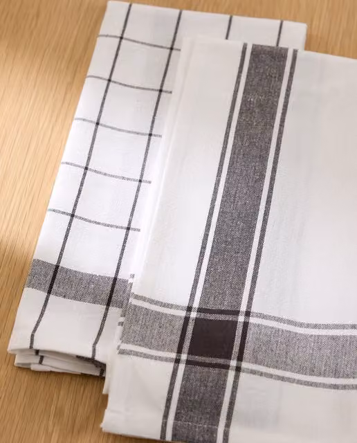 Set de 2 paños de sarga de algodón Nova de El Corte Inglés con diseño de cuadros en antracita y blanco