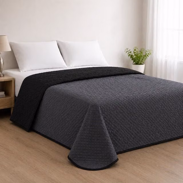 Colcha reversible acolchada Donegal Collections bicolor antracita y negro para cama de 105 cm