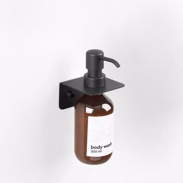 Dispensador individual de pared Manillons Torrent con bomba en acero inoxidable y plástico disponible en blanco o negro