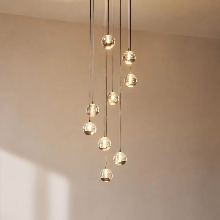 Lámpara colgante moderna Hayley de Lucande en cristal transparente y metal negro para salón o comedor