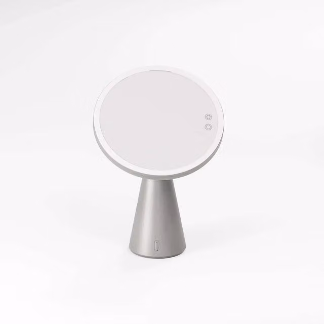 Espejo cosmético redondo Manillons Torrent con luz LED, altavoz Bluetooth y batería recargable en color blanco y plata