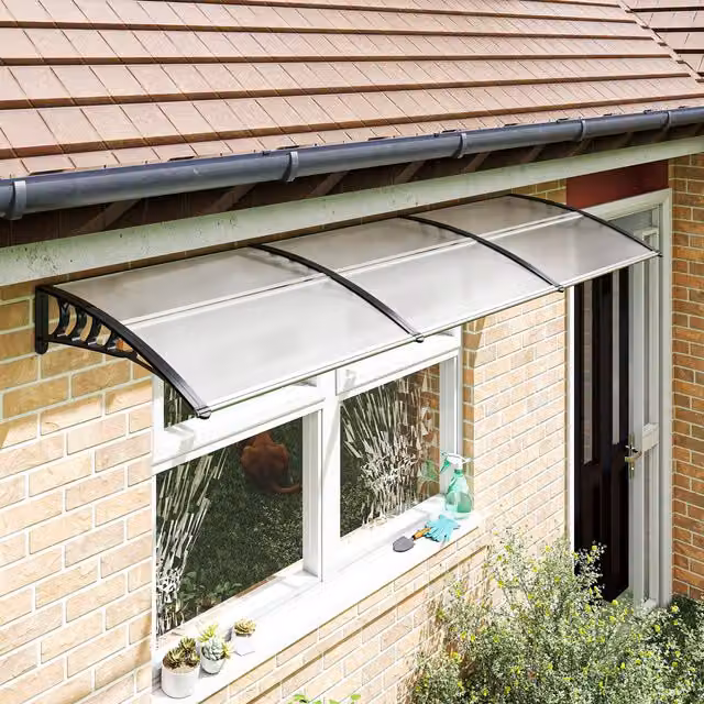 Toldo exterior curvo PZCC de policarbonato y aluminio, negro y transparente, An/P/Al: 295 x 90 x 23,5 cm